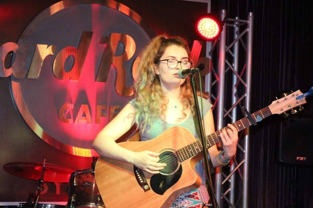 Aimée at the Hard Rock Cafe under red light